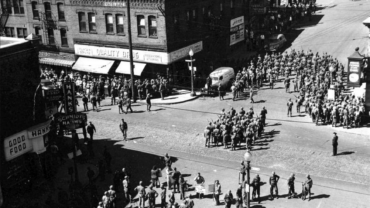 Surveillance photos taken from the Exchange Building show the National Guard gathered at the center of Concord Street at the height of the 1948 meatpackers strike.