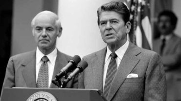President Reagan with William French Smith making a statement to the press regarding the air traffic controllers strike (PATCO) from the Rose Garden on August 3, 1981.